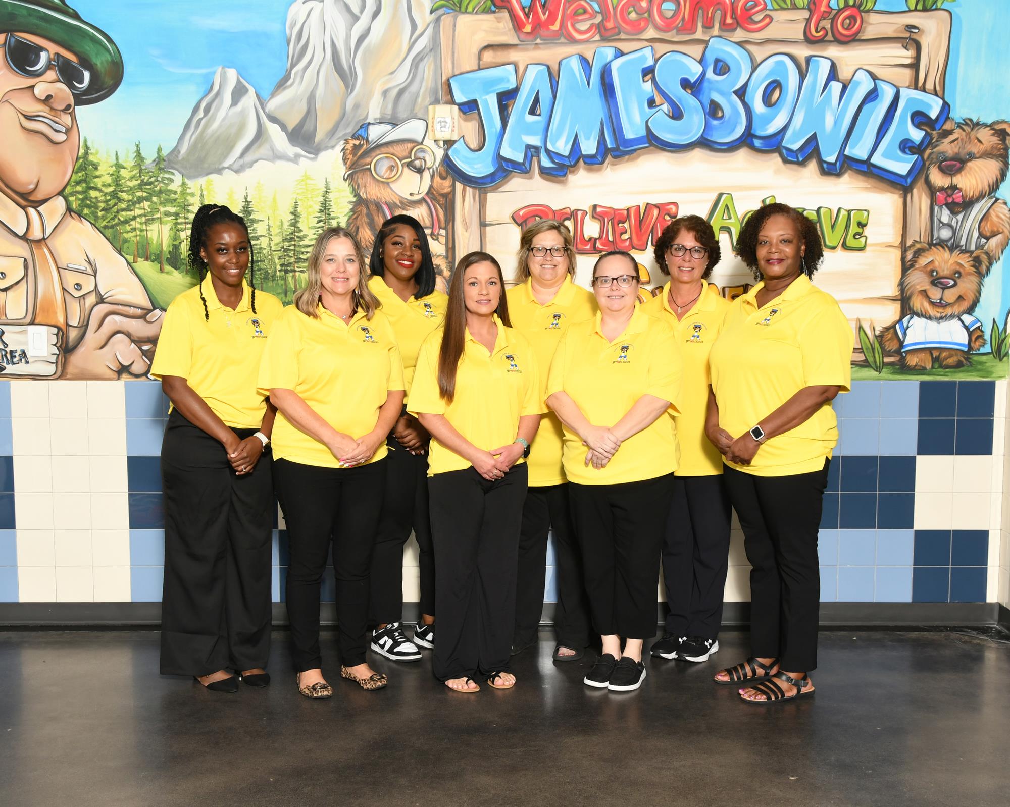 Special education staff smiling for staff picture