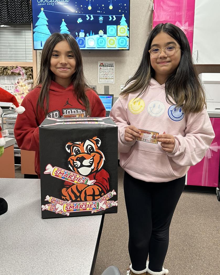 Students earn smartie cards for showing academic growth